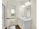 Light-filled bathroom featuring double sinks and a view into the bedroom offering seamless design at 2035 Frost Line Ln, Greenfield, IN 46140