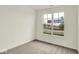 Bright bedroom with neutral carpet, a large window, and views of the neighborhood at 2035 Frost Line Ln, Greenfield, IN 46140