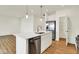 Spacious kitchen featuring a quartz island with stainless steel appliances and a pantry at 2035 Frost Line Ln, Greenfield, IN 46140