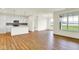 Open-concept living space with sleek, modern kitchen and luxury vinyl plank flooring throughout at 2035 Frost Line Ln, Greenfield, IN 46140