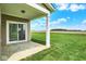 An outdoor patio has sliding glass door and a picturesque view of the verdant lawn and distant fields at 2035 Frost Line Ln, Greenfield, IN 46140