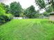 Expansive, fenced backyard with lush green grass, offering privacy and plenty of space at 22 Brooklyn Ct, Mooresville, IN 46158