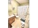 Functional bathroom featuring a shower and tub combination, light green walls, and vanity with storage at 22 Brooklyn Ct, Mooresville, IN 46158