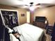 Spacious bedroom with a walk-in closet, and neutral carpet, and TV; a comfortable retreat for rest and relaxation at 22 Brooklyn Ct, Mooresville, IN 46158
