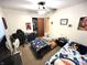 Bedroom features twin beds, ceiling fan, desk, and closet, creating a versatile and comfortable space at 22 Brooklyn Ct, Mooresville, IN 46158