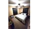 Comfortable bedroom includes ceiling fan, natural light, and neutral carpet, creating a warm and inviting atmosphere at 22 Brooklyn Ct, Mooresville, IN 46158