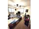 Shared bedroom features natural light, ceiling fan, desk, and twin beds, perfect for or guests at 22 Brooklyn Ct, Mooresville, IN 46158