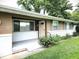 Inviting front porch with brick accents, providing a warm welcome to this charming home at 22 Brooklyn Ct, Mooresville, IN 46158