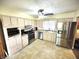 Well-appointed kitchen with stainless steel appliances and neutral-toned cabinets, lots of storage at 22 Brooklyn Ct, Mooresville, IN 46158