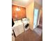 Efficient laundry area equipped with modern washer, dryer, and storage cabinets, enhancing home convenience at 22 Brooklyn Ct, Mooresville, IN 46158