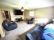 Spacious living room with leather furniture, offering a comfortable and inviting atmosphere at 22 Brooklyn Ct, Mooresville, IN 46158