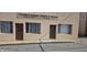 Commercial building exterior with multiple windows and glass doors, and clear signage at 22 W 8Th St, Anderson, IN 46016