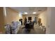 Spacious conference room with large table, chairs, and storage boxes along the walls and shelves at 22 W 8Th St, Anderson, IN 46016