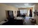 Office with bookshelves, furniture, and decor at 22 W 8Th St, Anderson, IN 46016