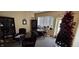 Small office space featuring chairs, round table, bookcases, and a christmas tree at 22 W 8Th St, Anderson, IN 46016