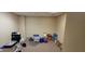 A storage room with boxes, equipment, and supplies neatly arranged against the walls on carpet at 22 W 8Th St, Anderson, IN 46016