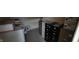 A storage room featuring rows of filing cabinets and stacked boxes against plain neutral colored walls at 22 W 8Th St, Anderson, IN 46016