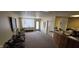 A waiting area with an exit door and carpeted floors at 22 W 8Th St, Anderson, IN 46016