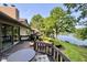 Spacious deck offers stunning lake views, perfect for outdoor dining and enjoying the serene natural surroundings at 2213 E Canterbury Ct, Martinsville, IN 46151