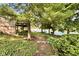 Picturesque backyard with a pathway leading to a lake, creating a serene and inviting outdoor space at 2213 E Canterbury Ct, Martinsville, IN 46151