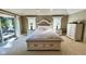 Comfortable bedroom with a king-sized bed, matching nightstands, and dresser, perfect for relaxation and restful nights at 2213 E Canterbury Ct, Martinsville, IN 46151