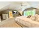 Bright bedroom boasts neutral decor, large windows, TV, and seating area, creating a cozy and inviting retreat at 2213 E Canterbury Ct, Martinsville, IN 46151