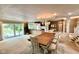 Open floorplan of the dining room with lake views through large glass windows at 2213 E Canterbury Ct, Martinsville, IN 46151