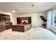 Bright home office with custom cabinets, desk, and a wet bar, perfect for working from home at 2213 E Canterbury Ct, Martinsville, IN 46151