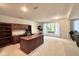 Spacious home office with custom built-ins, a large desk, and a bright window at 2213 E Canterbury Ct, Martinsville, IN 46151
