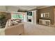 Cozy living room with a fireplace, built-in cabinets, and outdoor views at 2213 E Canterbury Ct, Martinsville, IN 46151