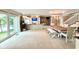 Open living space with a fireplace, dining area, and large glass windows at 2213 E Canterbury Ct, Martinsville, IN 46151