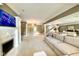 Bright open living room with fireplace, stairs, and dining area at 2213 E Canterbury Ct, Martinsville, IN 46151