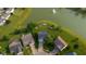 Aerial image displaying the home's location near a lake with a fountain at 2247 Rolling Hill Ct, Columbus, IN 47201
