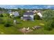 Aerial view showcasing the home's backyard, patio, and lush surroundings at 2247 Rolling Hill Ct, Columbus, IN 47201