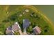 Overhead shot of the property and neighborhood, showing the backyard and lake at 2247 Rolling Hill Ct, Columbus, IN 47201