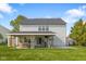 Spacious backyard featuring a covered patio area with comfortable seating at 2247 Rolling Hill Ct, Columbus, IN 47201