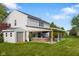 A spacious backyard featuring a covered patio and a storage shed at 2247 Rolling Hill Ct, Columbus, IN 47201