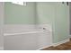 This bathroom features a soaking tub with tile surround and chrome fixtures at 2247 Rolling Hill Ct, Columbus, IN 47201