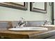 Close-up of bathroom vanity with dual sinks and crystal-like faucets at 2247 Rolling Hill Ct, Columbus, IN 47201