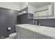 This bathroom has marble counters and a large rectangular mirror above the sink at 2247 Rolling Hill Ct, Columbus, IN 47201