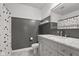 Updated bathroom with marble countertop, gray wainscoting, and polka dot shower curtain at 2247 Rolling Hill Ct, Columbus, IN 47201