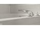 Close up on the tub with chrome faucet, chrome knobs and ceramic tile at 2247 Rolling Hill Ct, Columbus, IN 47201