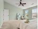 Bright bedroom with carpeted floors, windows, and stylish furniture at 2247 Rolling Hill Ct, Columbus, IN 47201
