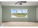 Bedroom with neutral carpet, a ceiling fan, neutral walls, and a view of a pond at 2247 Rolling Hill Ct, Columbus, IN 47201