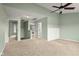 Bedroom with neutral carpet, a ceiling fan, and multiple entryways at 2247 Rolling Hill Ct, Columbus, IN 47201