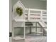 Close up on the white bunkbeds with slide and leaf wreath at 2247 Rolling Hill Ct, Columbus, IN 47201