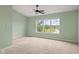 Bedroom with carpet, a ceiling fan, neutral walls, and a view of a pond at 2247 Rolling Hill Ct, Columbus, IN 47201