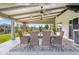 Outdoor covered patio with dining table and chairs, perfect for entertaining at 2247 Rolling Hill Ct, Columbus, IN 47201