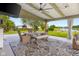 Lake view from the covered patio featuring outdoor dining area and backyard at 2247 Rolling Hill Ct, Columbus, IN 47201