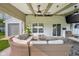 Covered patio featuring a comfortable seating area and a fire pit table at 2247 Rolling Hill Ct, Columbus, IN 47201